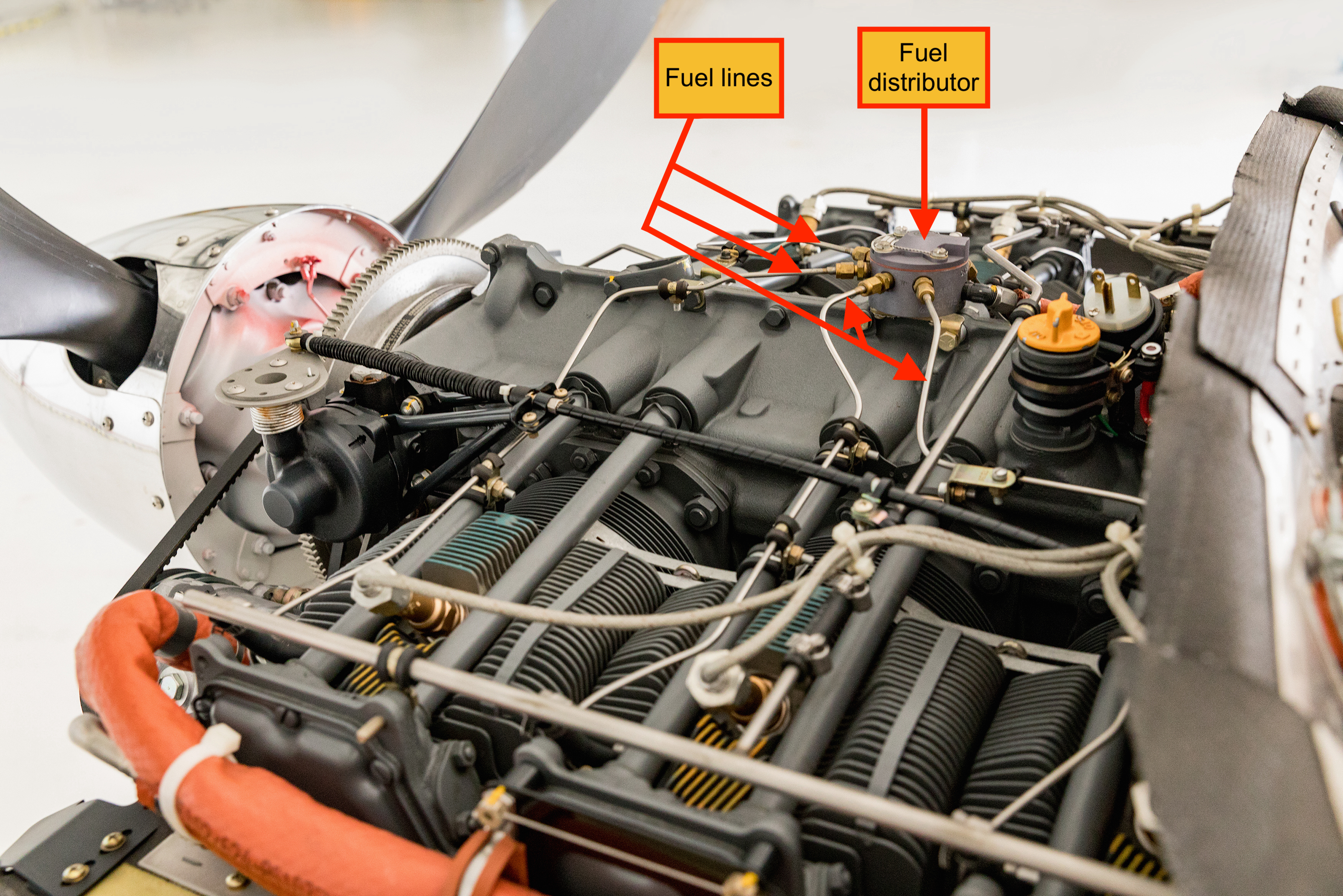 aircraft engine showing fuel lines and fuel distributor