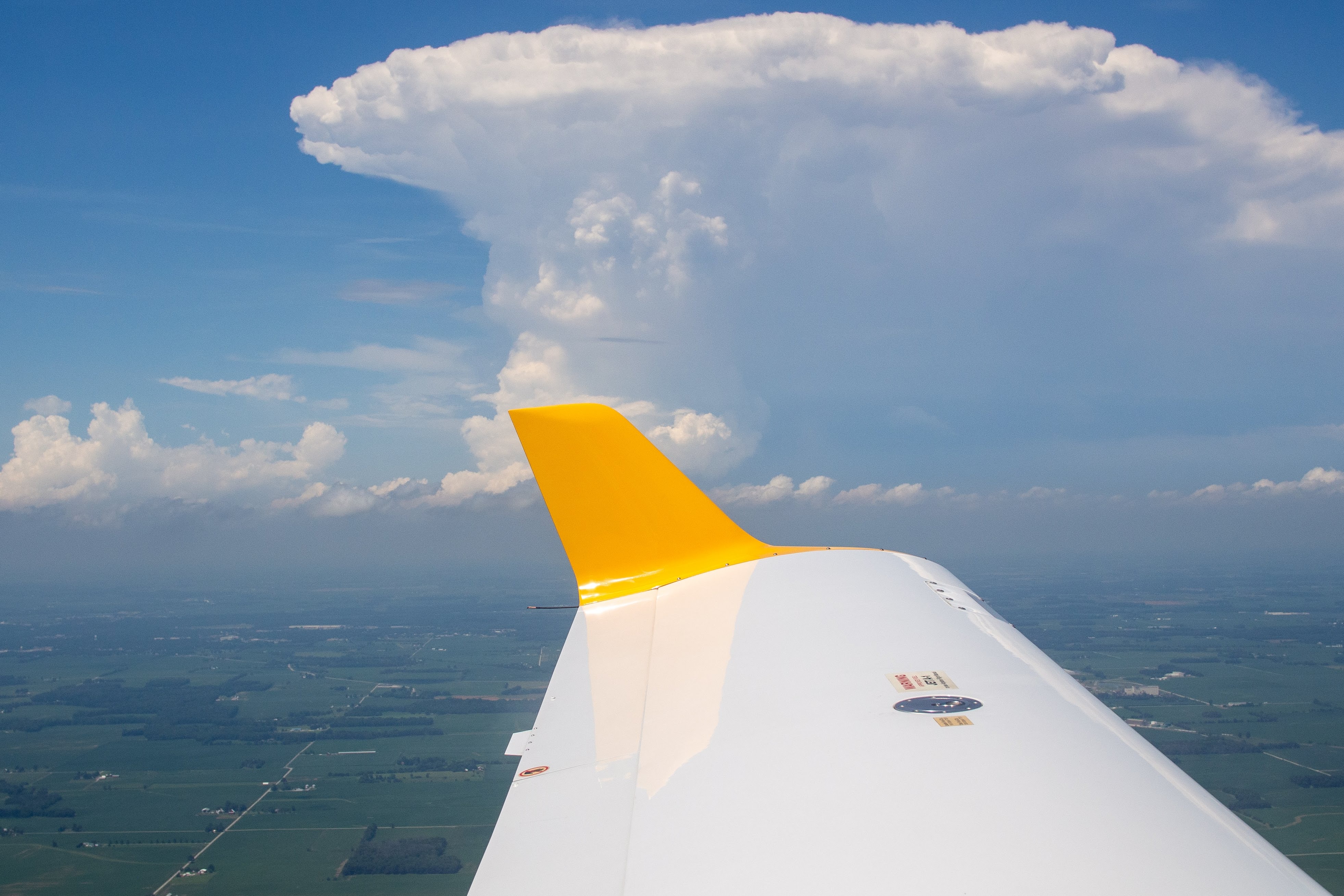 cumulonimbus cloud on an aeroplane wing