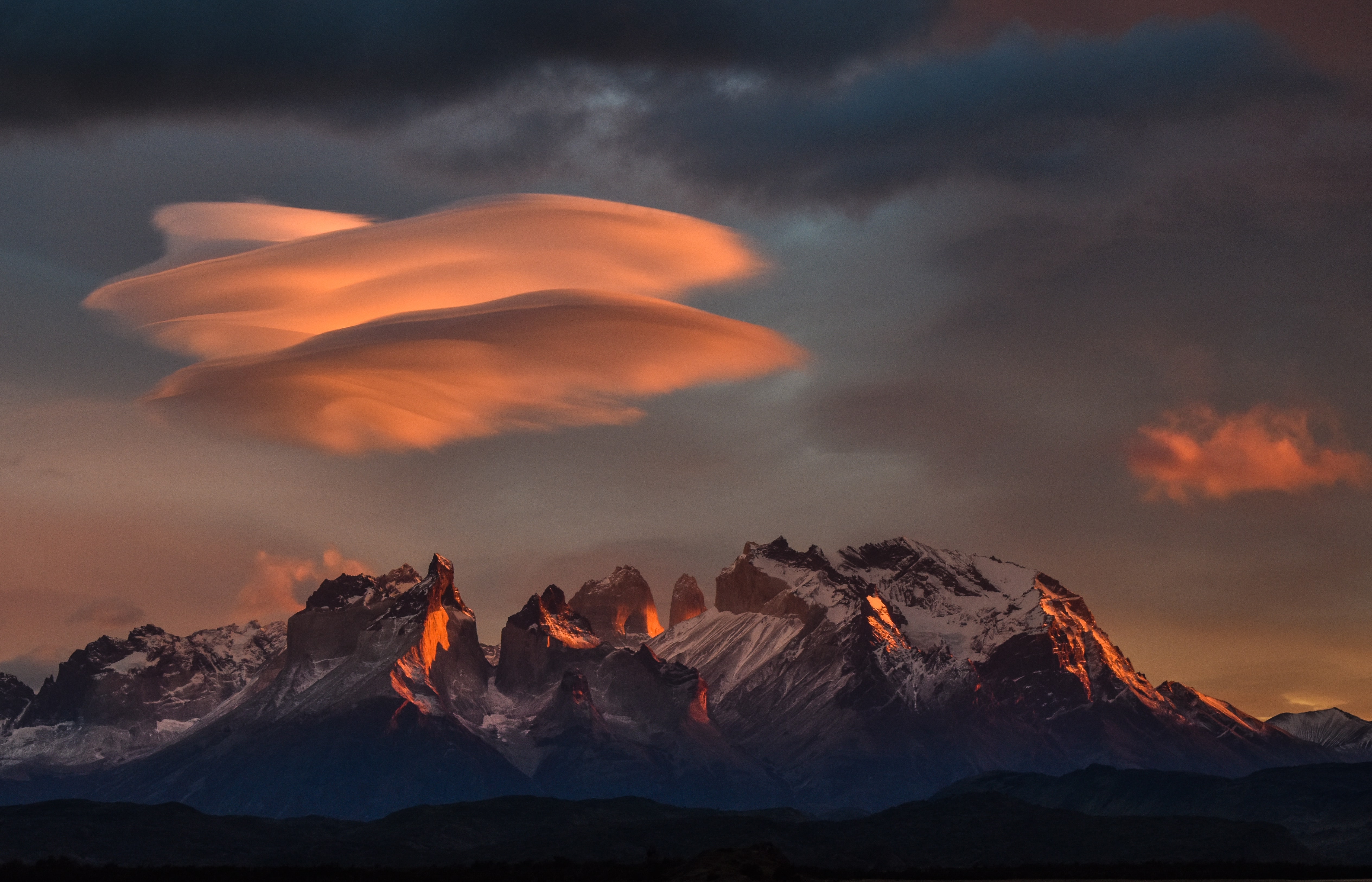 lenticular clouds over mountains